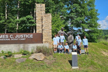Group photo of Scouts at camp logo