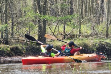 Scouts paddling a kayak on the Mullica River