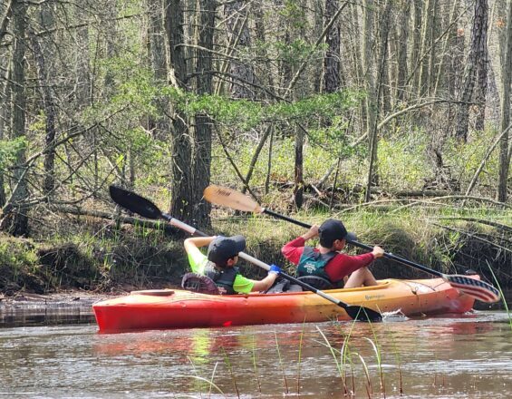 Scouts paddling a kayak on the Mullica River